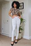 Mid Rise Ripped Ankle Skinny Jeans#color_white